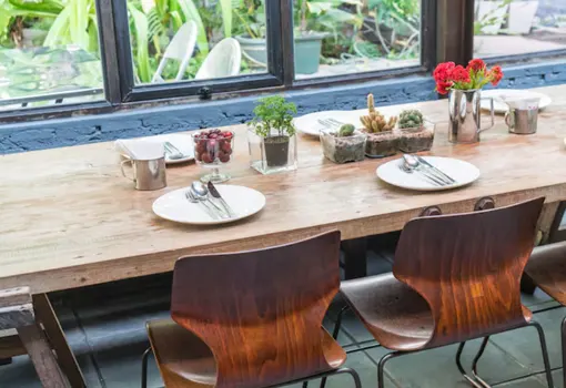Space-saving compact dining table